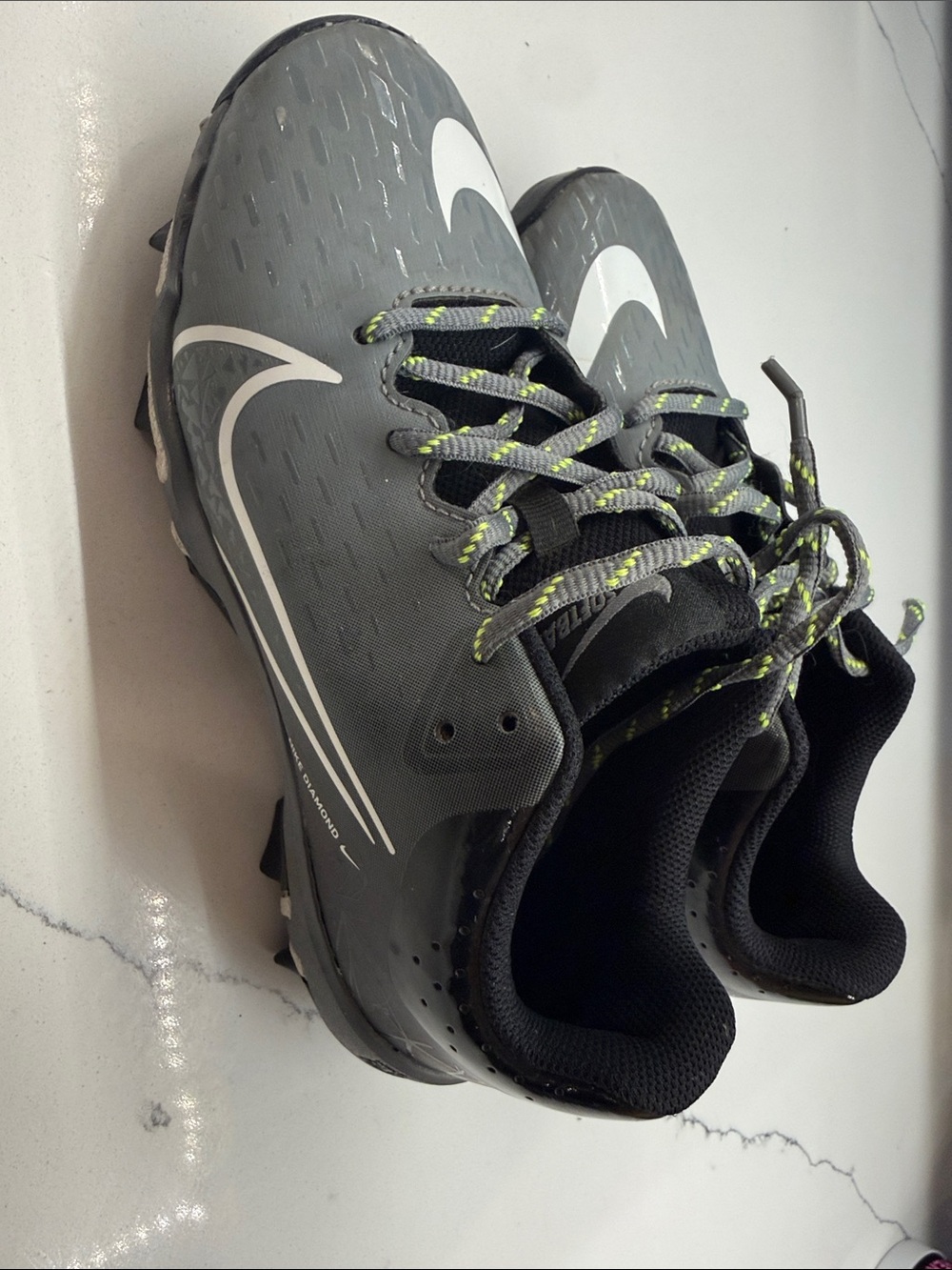Nike Gray Cleats with White Swoosh and Neon-Lime Accents
